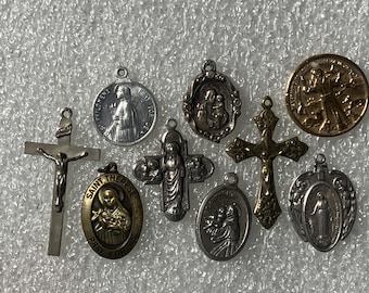 Lot of 9 religious medallions, charms, etc.