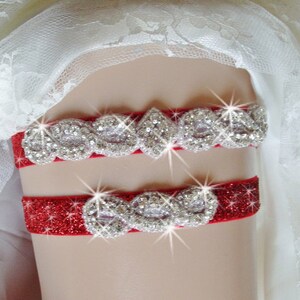May include: Red garter with a sparkly red band and a silver rhinestone design.