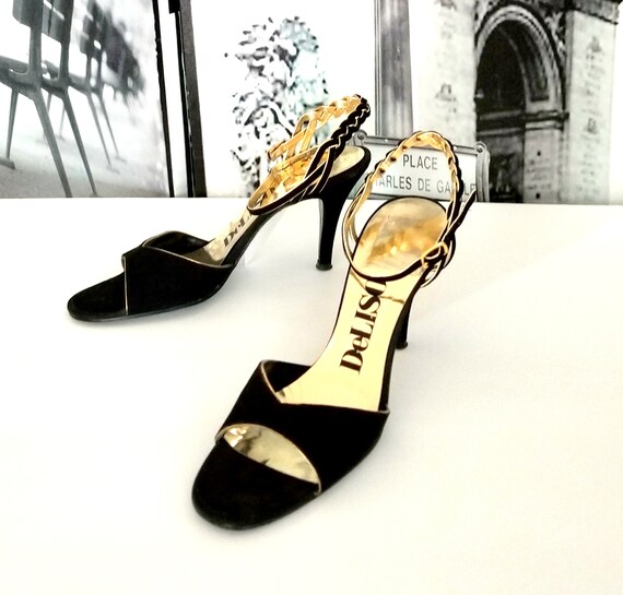 black pumps with gold accents