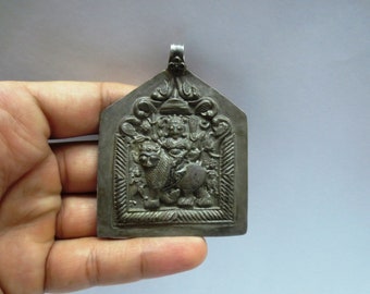 antique pendage with silver alloy coin