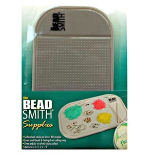 May include: A gray Bead Smith Supplies bead board with a textured surface. The board has a curved top and is packaged in clear plastic. The packaging includes the text "BEAD SMITH Supplies" and product features. The board measures 8.2 cm x 14 cm.