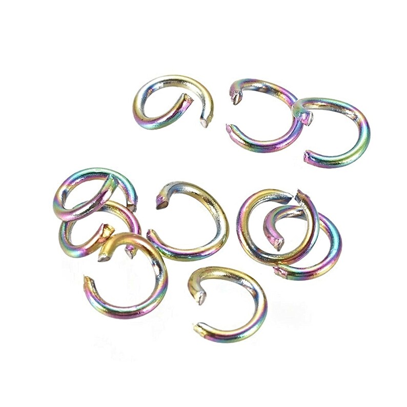 May include: A group of 10 rainbow colored metal jump rings. The rings are about 1/2 inch in diameter.