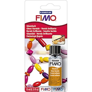 Rectangular cardboard backing stating staedtler fimo gloss varnish 10ml (0.33 fl oz) with a small glass bottle containing varnish