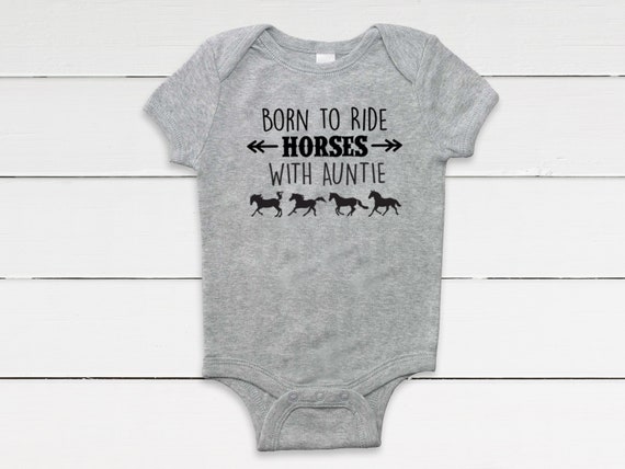 baby clothes with horses on them