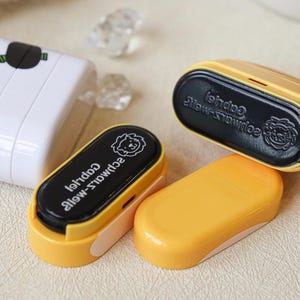May include: Four yellow and black stampers with a lion design and the text "Schwalz-wei&szlig;" and "Gabriel" on the black part.