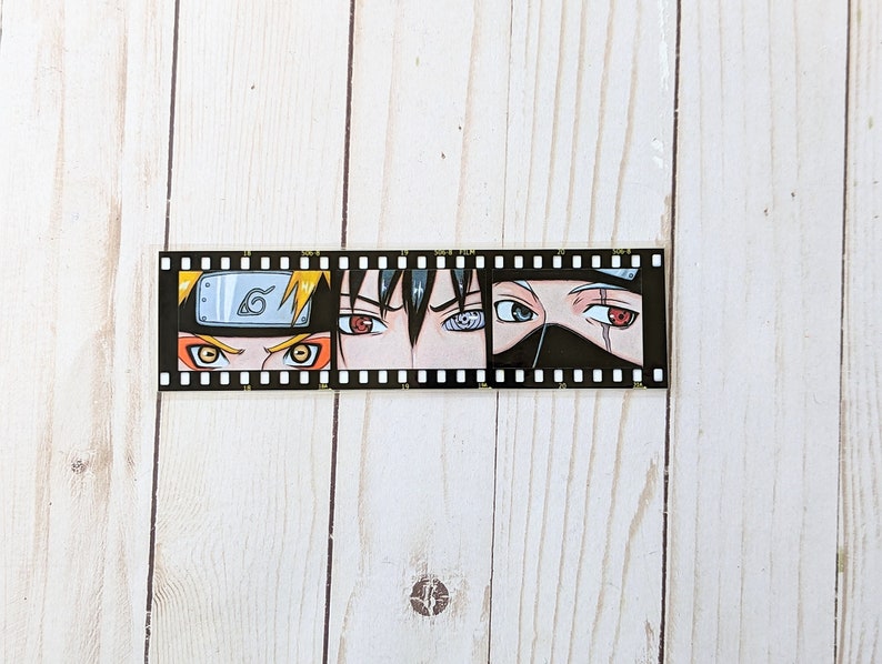 May include: A film strip with four close-up images of anime characters' eyes. The characters are Naruto, Sasuke, Kakashi, and Itachi. The eyes are drawn in a manga style with vibrant colors and detailed shading.