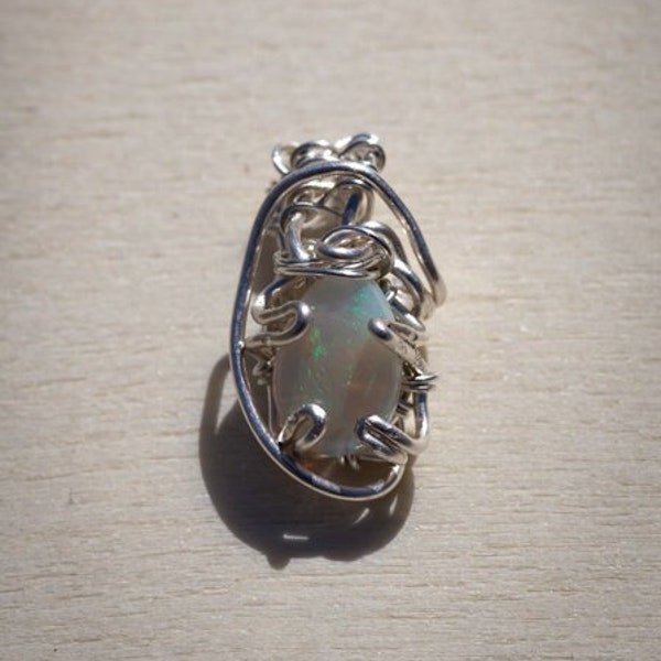 Precious White Opal in fine silver pendant