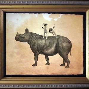 May include: Framed artwork featuring a detailed illustration of a rhinoceros with a small dog standing on its back. The artwork has a vintage aesthetic, with a sepia-toned background and a gold-colored frame.