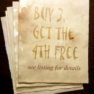 May include: A stack of aged, cream-colored paper with brown edges. The text "BUY 3, GET THE 4TH FREE" is printed in brown ink. Below the text is the phrase "see listing for details" in smaller brown text.