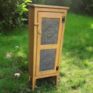 Rustic farmhouse cabinet, handmade storage cupboard with punched tin door, antiqued mustard finish