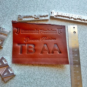 Stamp for embossing name or short text