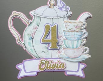 May include: A set of three ceramic mugs with a speckled, matte finish. The mugs are in shades of cream, light gray, and dark gray. Each mug has a simple, minimalist design and a rounded handle.