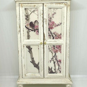 Handmade miniature dolls house furniture. Shabby chic cream coloured wardrobe with bird in blossom tree decals