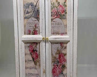 Hand painted 1:12th scale miniature dolls house furniture. Shabby chic cream coloured wardrobe with Parisian style decals