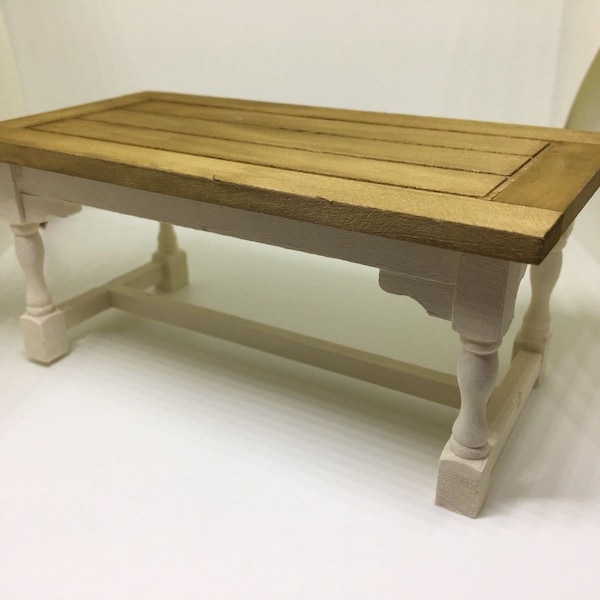 Handmade miniature dolls house furniture. Cream coloured wooden refectory table with oak effect finish top