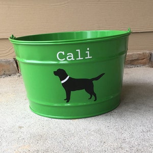 May include: Green metal bucket with a black silhouette of a dog and the name "Cali" written in white.