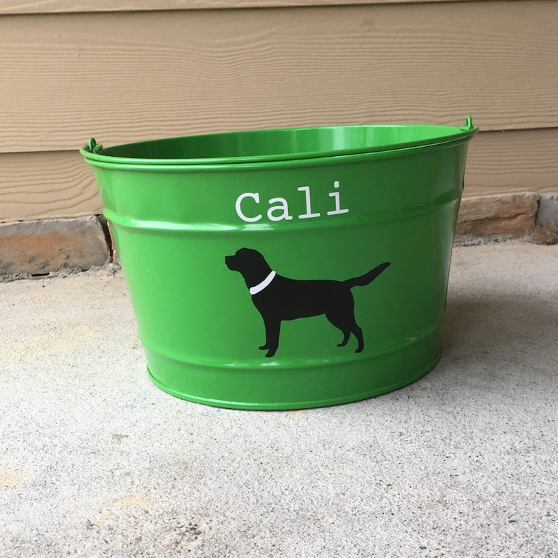 May include: Green metal bucket with a black silhouette of a dog and the name "Cali" written in white.