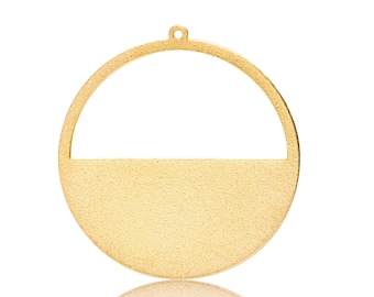 May include: A gold-colored metal ornament shaped like a circle with a cut-out section at the top. The ornament has a textured surface and a hole at the top for hanging.