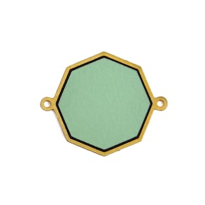 May include: A gold hexagonal charm with a green center and a black outline. The charm has two small loops on the sides.