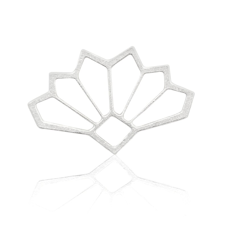 May include: A silver geometric fan-shaped pendant with a textured finish.