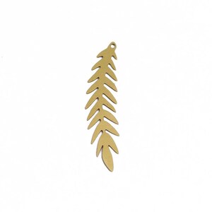 May include: A gold-colored metal leaf charm with a detailed fern-like design. The charm is perfect for adding a touch of nature to jewelry projects.