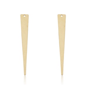 May include: Two gold-colored metal earring findings with a pointed tip and a small hole at the top.