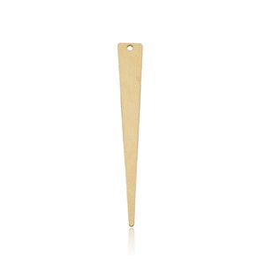 May include: A gold-colored metal pendant shaped like a sharp point, with a small hole at the top for attaching a chain or cord.