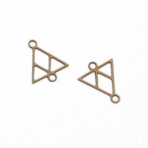 May include: Two gold-toned metal triangle charms with openwork designs and jump rings.