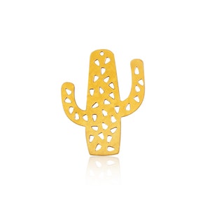 May include: A gold-colored metal cactus cutout with a geometric design. The cactus is a popular home decor item.