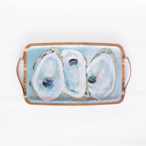 May include: A rectangular wooden serving tray with blue painted oyster shells on a light blue background. The tray has two wooden handles.