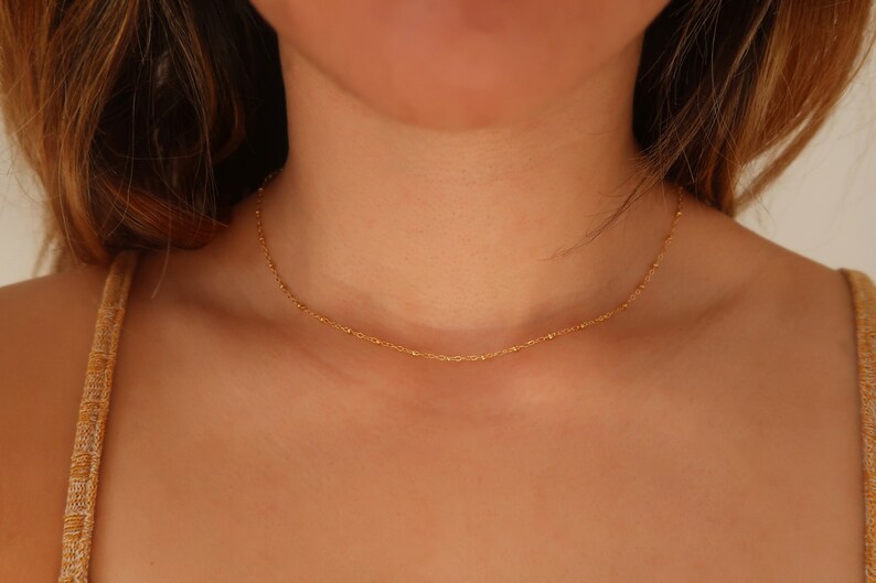 thumbnail interactive-video image 1 of DAINTY Women's Gold Plated Titanium Stainless Steel 3mm Bead Chain Choker Necklace (12-18") 1 of 6