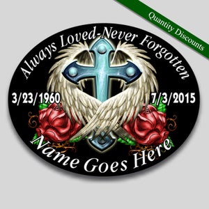 May include: A black oval memorial with a white cross with wings, red roses, and the text "Always Loved-Never Forgotten", "3/23/1960", "7/3/2015", and "Name Goes Here".