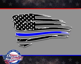May include: A distressed American flag with a thin blue line running horizontally across the middle. The flag is black and white with a blue line. The flag is in a distressed style, with the edges frayed and the colors faded. The flag is a symbol of support for law enforcement.