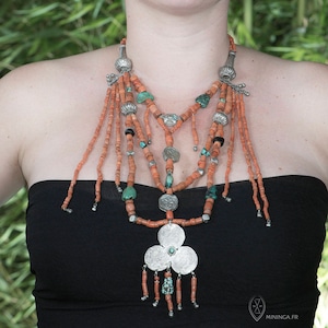 Unique Tibetan necklace with coral turquoise and silver charms