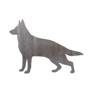 May include: Silhouette of a German Shepherd dog cut out of metal with a brushed silver finish.