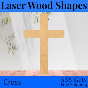 May include: A wooden cross shape, laser cut from natural wood. The cross is a simple design with a smooth, light brown finish.  The cross is displayed on a wooden surface with a blurred background.
