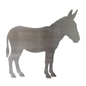 May include: A flat, two-dimensional metal silhouette of a donkey standing in profile, facing right. The object features a brushed, matte gray finish with visible horizontal graining across the entire surface, capturing the animal's form.