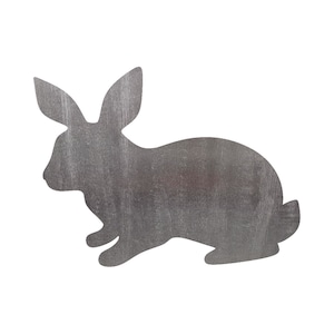 May include: A silver metal rabbit silhouette with a textured surface.