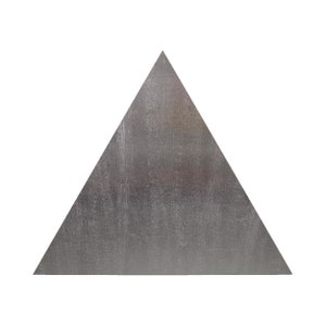 May include: A silver triangle with a textured surface.