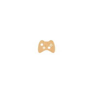 May include: A wooden cutout of a video game controller. The controller is light brown and has a white plus sign and circle button.