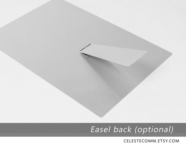 May include: The back of a metal print with an easel stand. The stand is made of metal and folds down flat.