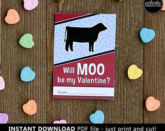 May include: A printable Valentine's Day card featuring a black silhouette of a cow with the text "Will MOO be my Valentine?" and a line for the sender's name. The card is surrounded by pink, blue, and yellow candy hearts.