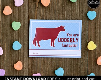 May include: A blue and white printable Valentine's Day card with a red cow silhouette and the text "You are UDDERLY fantastic!"  The card has a space for a name at the bottom.