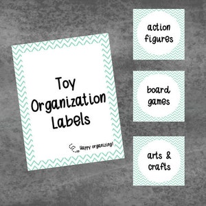 May include: Toy organization labels with a teal chevron pattern. The labels say "Toy Organization Labels" and "Happy organizing!" The labels are for action figures, board games, and arts & crafts.