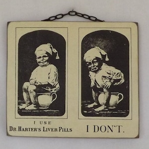 May include: A vintage wood sign with two black and white illustrations of children. The sign reads "I use Dr. Harter's Liver Pills I don't."