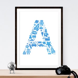May include: A blue and white printable art print featuring the letter A made up of various blue icons, including a rocket, a dinosaur, a soccer ball, a camera, a train, a robot, a star, a car, a pencil, an ice cream cone, a teddy bear, and a musical note.