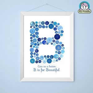 May include: A white framed print with a blue letter B made of buttons. The text "Cute as a button B is for Beautiful" is below the letter.