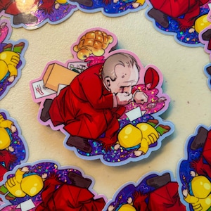 Puede incluir: Una colección de pegatinas con una ilustración de dibujos animados de un hombre con un traje rojo, encorvado con una expresión triste. Las pegatinas tienen un borde holográfico y están dispersas sobre una superficie clara. Otras pegatinas muestran una figura amarilla.