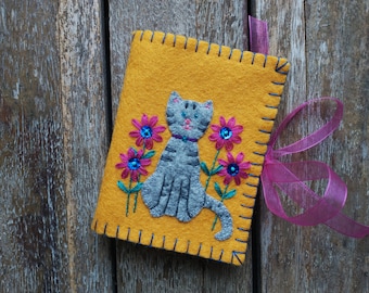 Yellow Gold Wool Felt Needle book with a Gray Tabby Cat Appliqued on the Cover and Embroidered with Magenta Flowers with Blue Sequin Centers