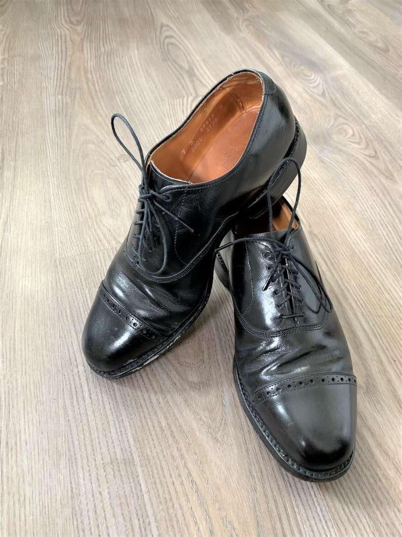 black cap toe shoe